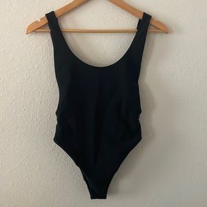 Small Aerie. One-piece black swimwear. Open sides, very low back!